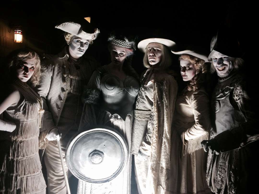 a group of people dressed up in costumes
